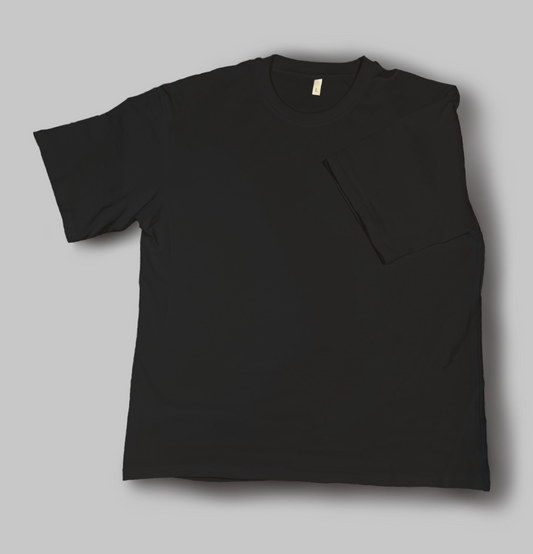A black cotton T Shirt laid out flat with a sleeve folded into the middle of the shirt